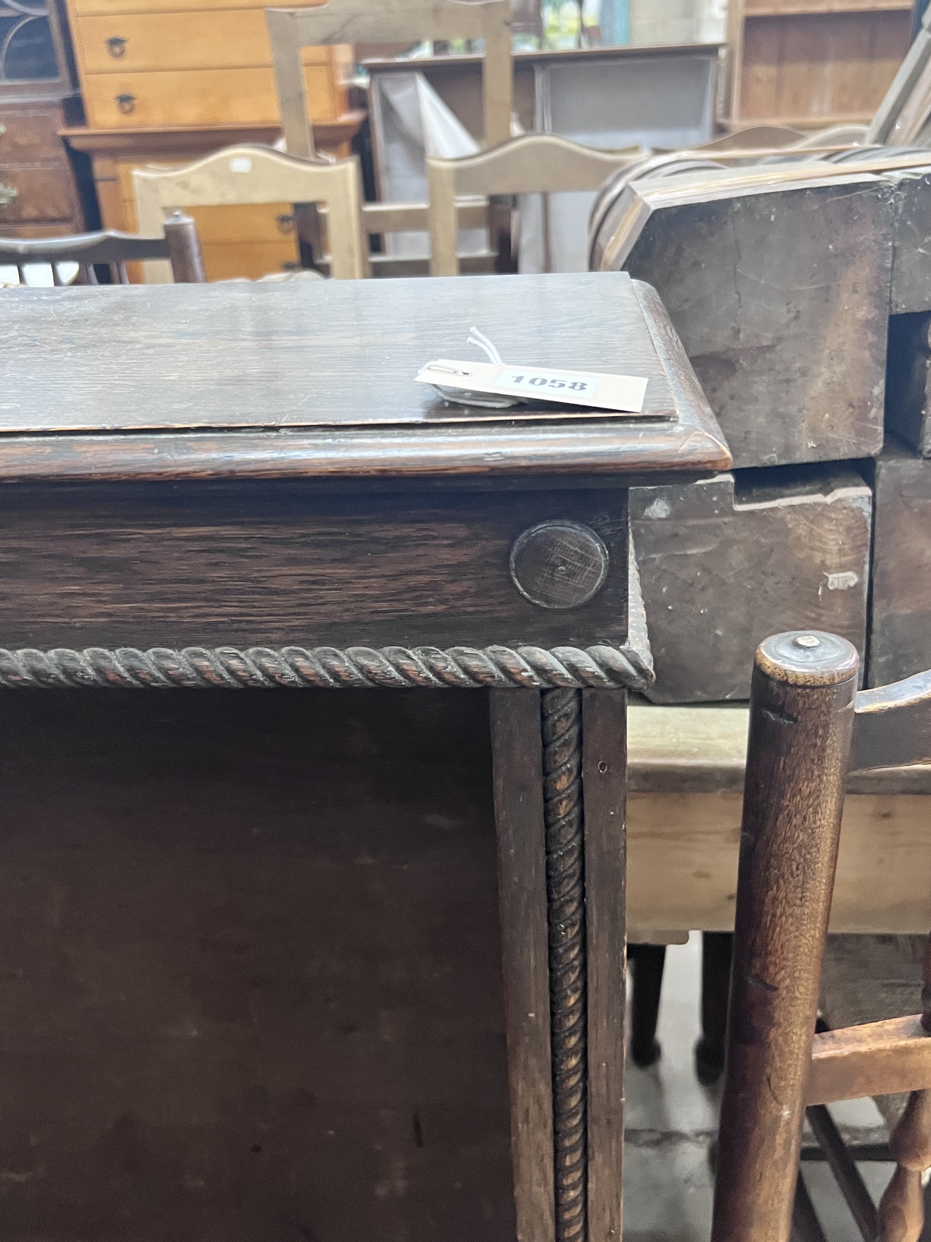 An early 20th century oak open bookcase, length 99cm, depth 25cm, height 107cm